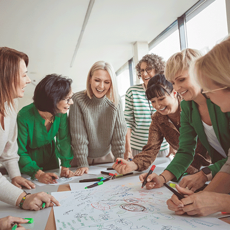 Happy colleagues doing team building activity