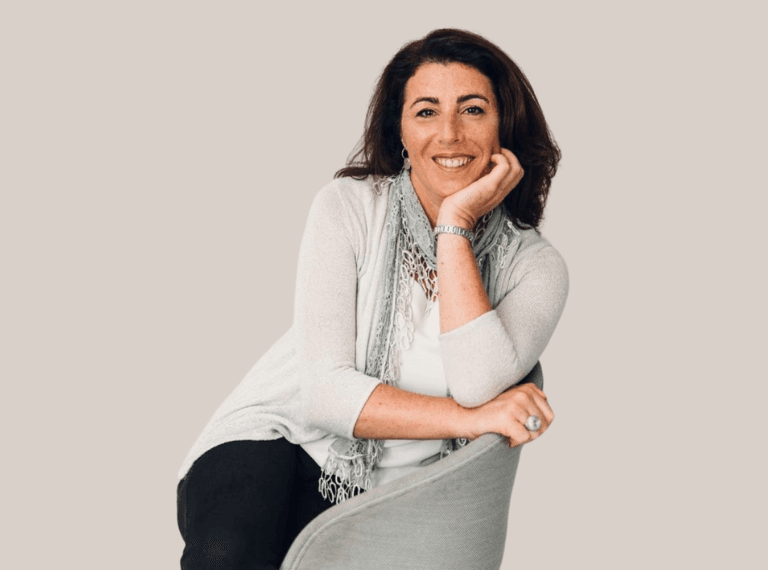 Businesswoman giving presentation on device screen during meeting.