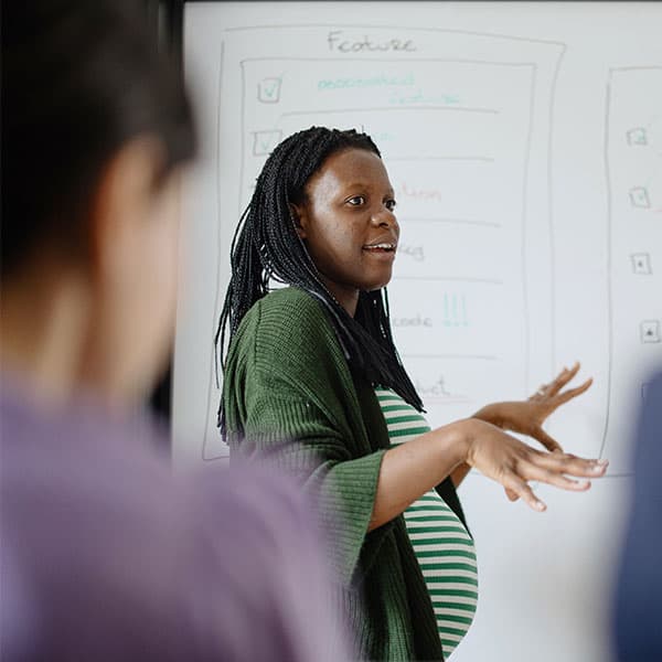 Pregnant team member gives presentation