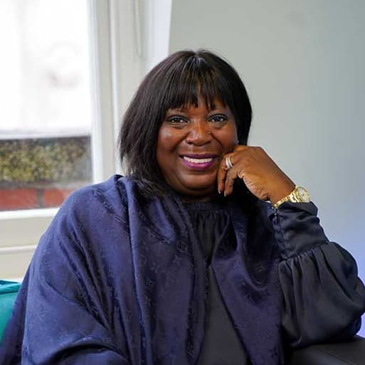 Dr Heather Melville - the first guest on James Reed's all about business podcast, sitting smiling