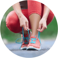 A person tying their shoe laces